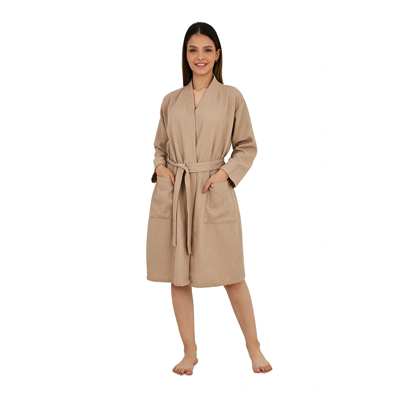 Beige tan waffle-textured knee-length bathrobe with tie belt and front pockets - loungewear ecommerce photography by Lohar Studio Delhi